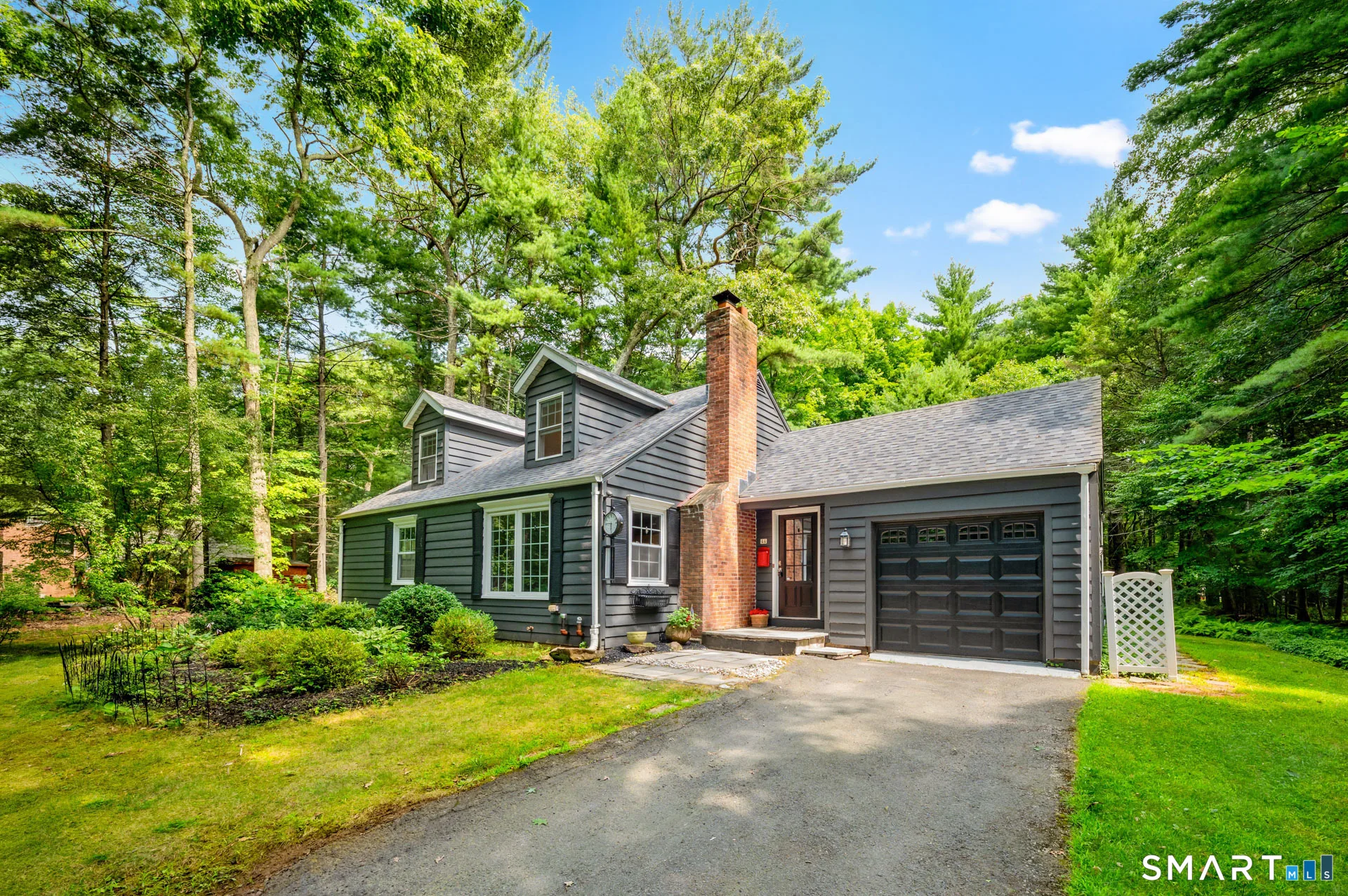44 Climax Rd, Simsbury, CT: a four-bedroom Cape on 1.2 wooded acres