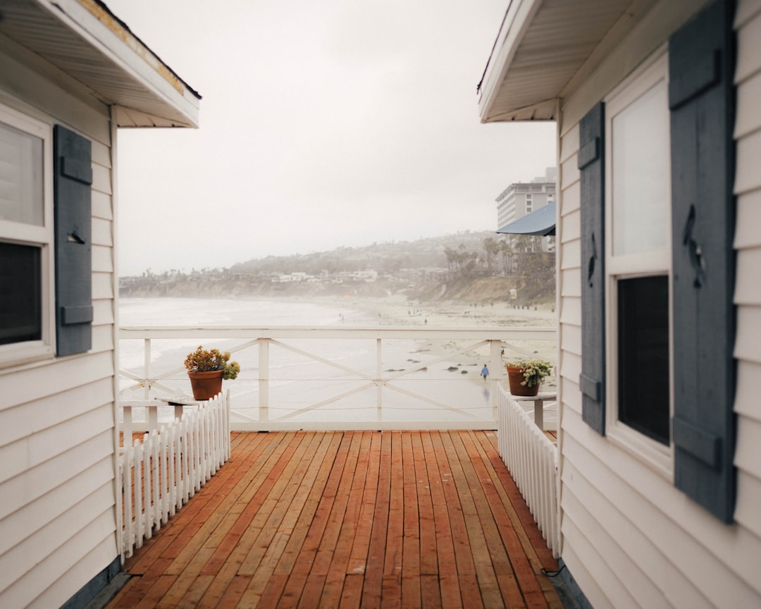 White wooden fence on brown wooden dock during daytime — Photo by Mason Dahl on Unsplash